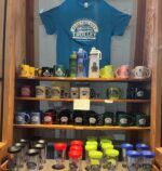 Mugs, water bottles, and cups that are available for purchase inside the Electric City Trolley Museum
