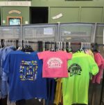 From left to right: Blue Youth "Trains" short sleeve tee shirt, Pink Toddler "Electric City Trolley" short sleeve tee shirt, Neon Green Youth "Electric City Trolley" short sleeve tee shirt